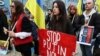 Ukrainians protest in front of the Brazilian Embassy in Lisbon on April 21.