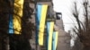 KOSOVO: Ukrainian flags displayed in Pristina downtown on the eve of the first anniversary of the start of invasion