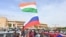 Supporters of Niger's coup wave Nigerien and Russian flags as they demonstrate in Niamey in August. 