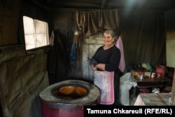 Manana Bibiluri, makes fresh nazuki sweetbread off the roadside in Surami. She plans to retire rather than work at a new location near the new Chinese-made highway when it opens.