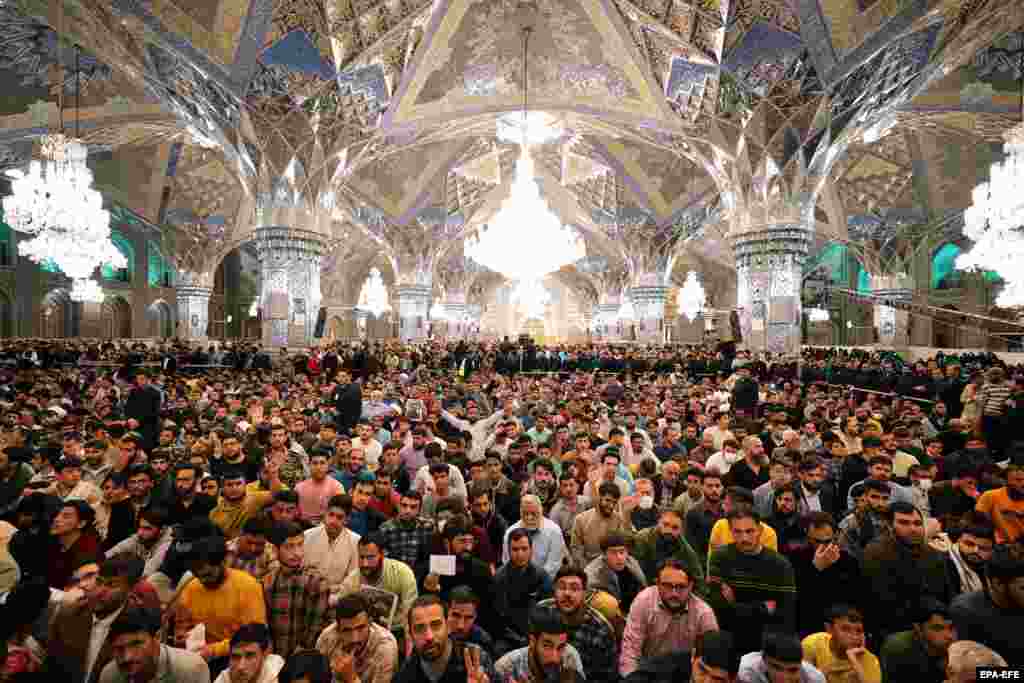 A crowd greets Iranian Supreme Leader Ayatollah Ali Khamenei in the city of Mashhad.