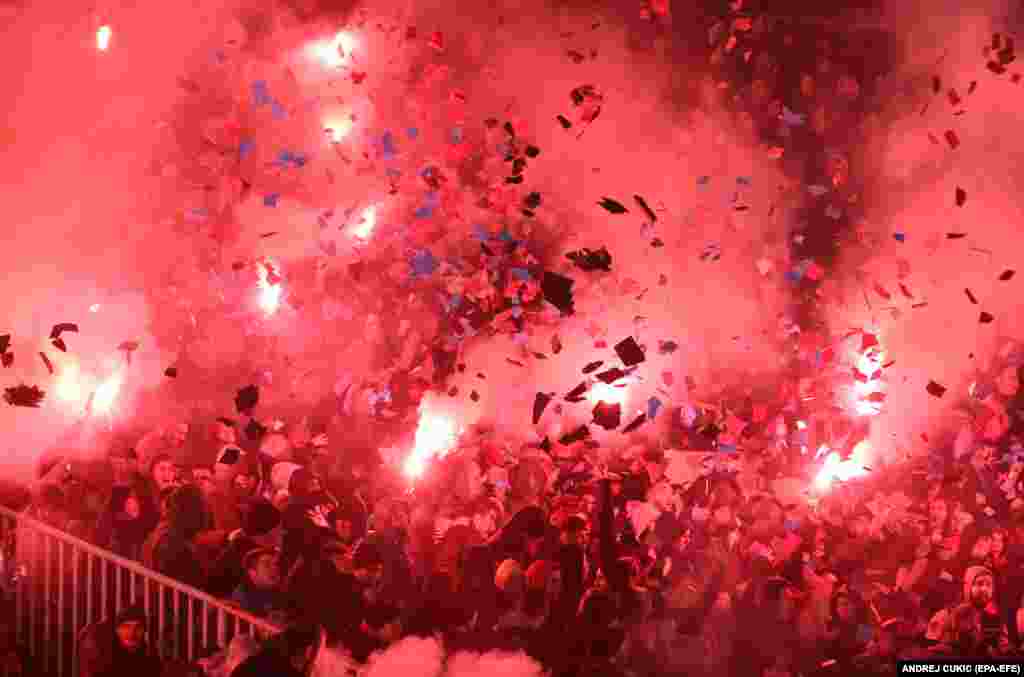 Red Star supporters light torches and smoke grenades during the Serbian SuperLiga soccer match between Partizan and Red Star in Belgrade December 20.