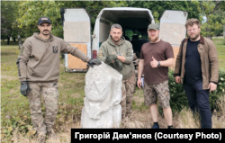Volunteers pose for a photo during the evacuation of Polovtsian sculptures from the Donetsk region.