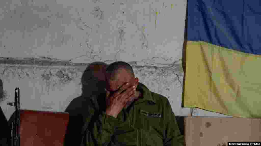A Ukrainian soldier rests after a heavy battle near Izyum, in the Kharkiv region, on May 2, 2022. &nbsp; &nbsp;
