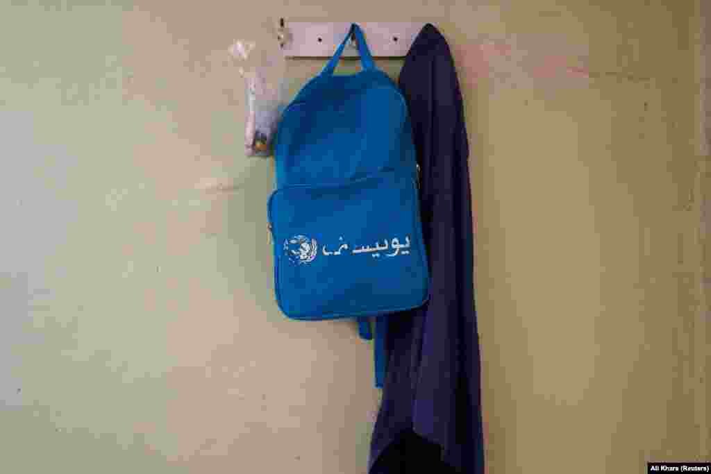 A backpack with a UNICEF logo hangs in the Karim home. About three-quarters of Afghanistan&#39;s people are in need of humanitarian aid as their country emerges from decades of conflict under an internationally isolated Taliban administration. Restrictions imposed by the Taliban on women have also put off donors, many of whom have turned their attention to other humanitarian crises. &nbsp;