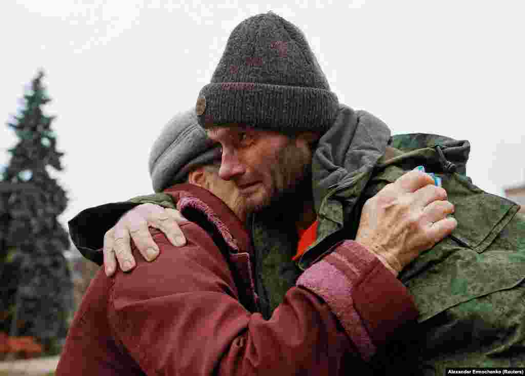 Yevgeny, a soldier from the Russian-controlled part of Ukraine&rsquo;s Donetsk region, hugs his mother Lyudmila in a town in the Donetsk region of Ukraine after a prisoner exchange with Ukrainian forces on November 6, 2022. &nbsp;