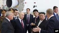 Russian President Vladimir Putin and North Korean leader Kim Jong Un examine a rocket assembly hangar during their meeting at the Vostochny cosmodrome outside the city of Tsiolkovsky in Russia's far eastern Amur region on September 13, 2023.