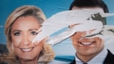 Предвыборный плакат французской ультраправой партии "Национальное объединение" с искаженными портретами Жордана Барделлы Марин Ле Пен