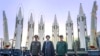 President Ebrahim Raisi (center) stands in front of Iranian missiles with other top officials last August.
