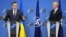 Ukrainian Foreign Minister Dmytro Kuleba (left, speaking to the press with NATO Secretary-General Jens Stoltenberg at NATO headquarters in Brussels in February) said decisions made at the summit had been "sharpened to accelerate our membership in NATO."