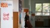 A voter attends a polling station in Skopje, where ballots were being cast in a dual presidential and parliamentary vote on May 8. 