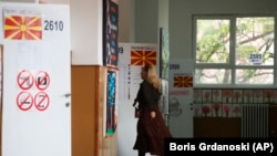 A voter attends a polling station in Skopje, where ballots were being cast in a dual presidential and parliamentary vote on May 8. 