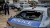 A damaged police car is seen following clashes between Kosovar police and ethnic Serb protesters in the town of Zvecan on May 26.