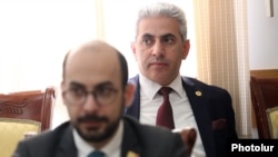 Armenia - Edgar Ghazarian (right) and pro-government deputy Artur Hovannisian attend a paliament committee meeting, April 4, 2023.