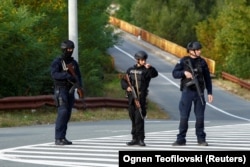 Kosovo police officers patrol a road to Banjska Monastery, in the aftermath of a shooting incident, near Zvecan, Kosovo, late last month.