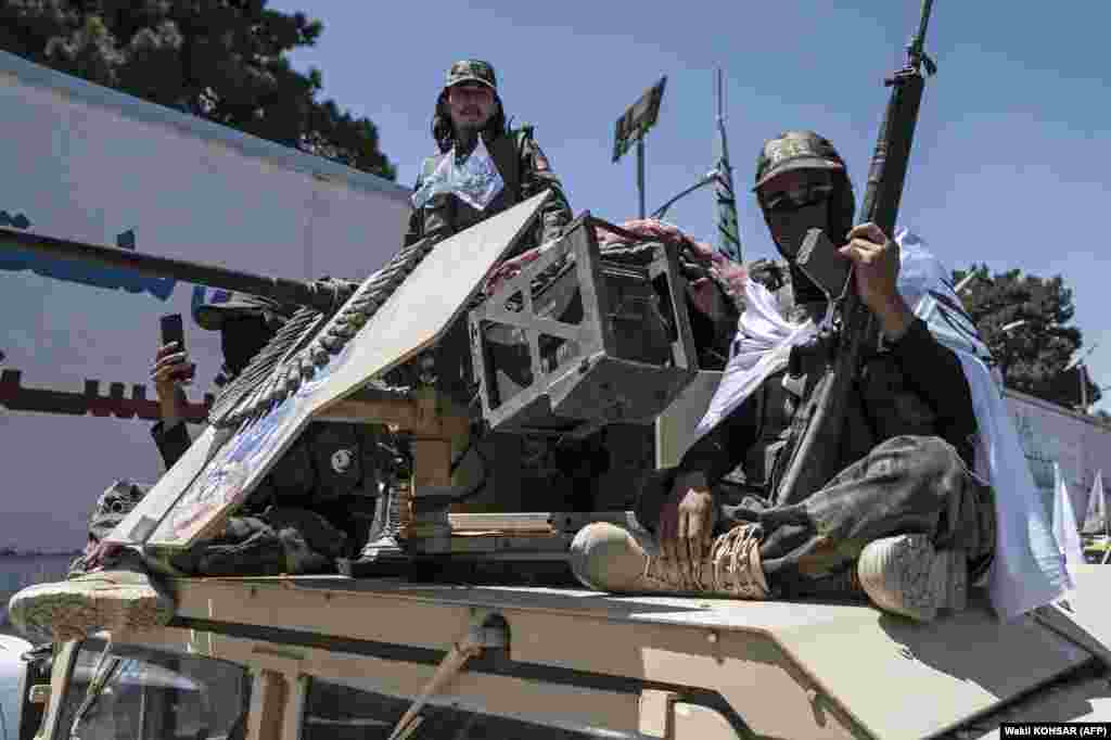 Armed Taliban security personnel parade on a Humvee convoy as they celebrate the second anniversary of their takeover near the U.S. Embassy in Kabul on August 15.