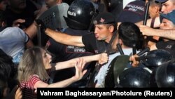 ARMENIA - Demonstrators scuffle with law enforcement officers during a protest against Armenian Prime Minister Nikol Pashinian in Yerevan, June 12, 2024.