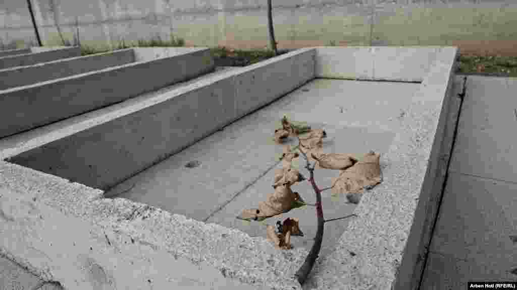 An empty, open grave in the village of Krusha e Vogel, in southern Kosovo, is reserved for the remains of missing war dead. The bodies of 61 people have yet to be found more than two decades after Serbian forces killed ethnic Albanians in a 1999 massacre. &nbsp;&nbsp;&nbsp; &nbsp;