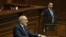 Armenia - A bodyguard stands near Prime Minister Nikol Pashinian as he speaks in the Armenian parliament, Yerevan, February 7, 2024.