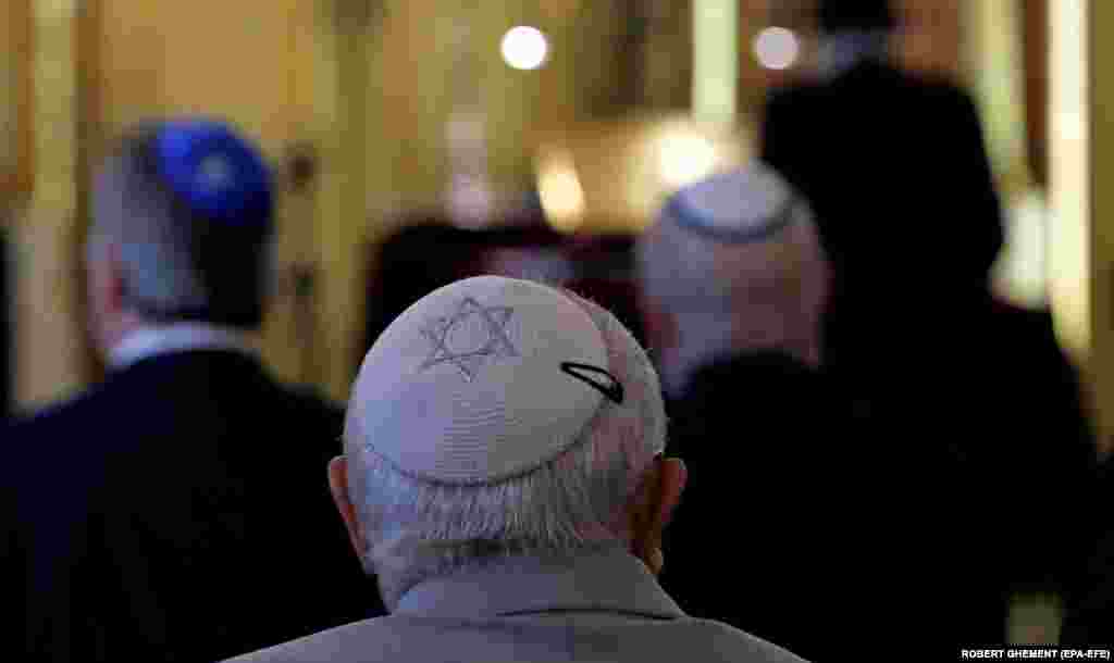 Members of the Romanian Jewish community attend the religious service that starts the holiday of Passover at the Coral Temple in Bucharest.