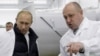  Armenia/Russia-Businessman Yevgeny Prigozhin shows Russian Prime Minister Vladimir Putin his school lunch factory outside Saint Petersburg on September 20, 2010. 