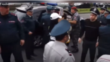 Police detaining protesters in Yerevan on May 11