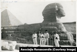 Romanian travelers pose near the Sphinx in Giza, Egypt.