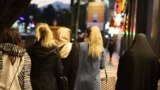 Several Iranian women are seen on a street in Tehran in April without the mandatory hijab.