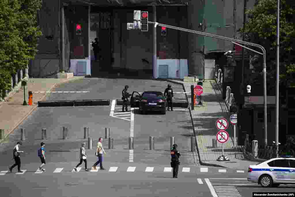 Security officers check a car as it approaches the Kremlin on June 25.&nbsp;