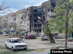 Разрушенное в результате боев здание. Снимок чешского криминалиста Яна Гержманека