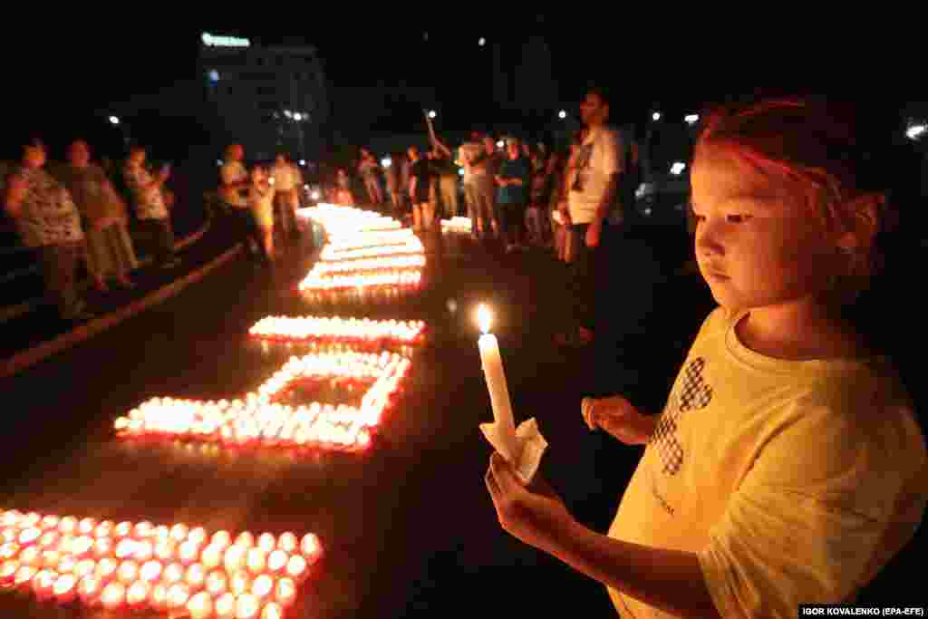 People hold candles at a memorial ceremony on Victory Square in the Kyrgyz capital, Bishkek, on the eve of the anniversary of the Nazi invasion of the Soviet Union, which began on June 22, 1941.&nbsp;