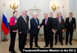 Aleksandr Studenikin (circled) in a photograph posted on the Facebook page of Russia's permanent mission to the EU in 2018. Four years later, Studenikin was among 19 Russian diplomats blacklisted by the EU, which accused them of "illegal and disruptive actions."