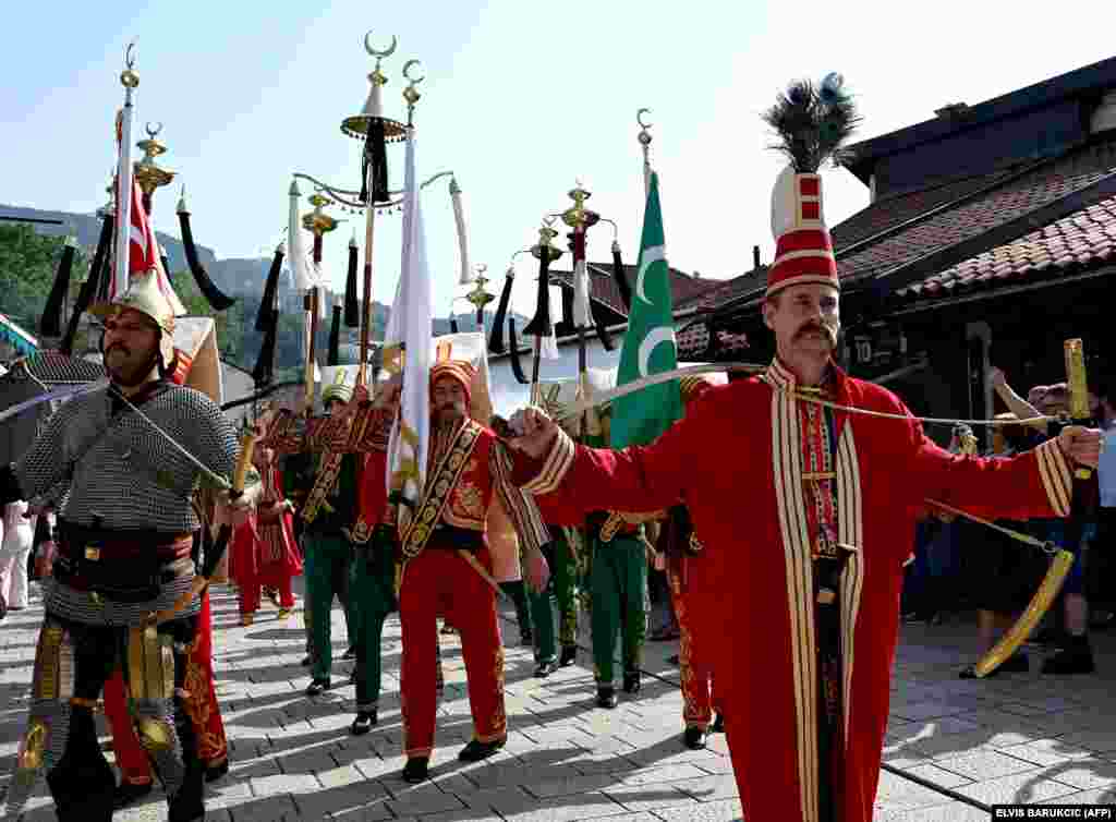 Members of the traditional Ottoman Mehteran&nbsp;military bands march in the street of the historical center Bascarsija in Sarajevo.