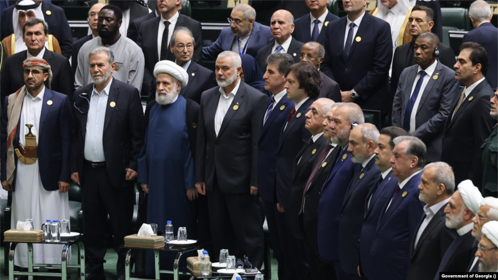 Hamas leader Ismail Haniyeh (center) attends the inauguration of the newly elected Iranian president in Tehran on July 30, the day before his death.