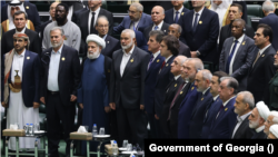 Hamas leader Ismail Haniyeh (center) attends the inauguration of the newly elected Iranian president in Tehran on July 30, the day before his death.