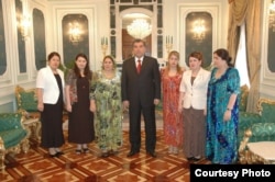 Tajik President Emomali Rahmon (center) stands with family members in an undated photo. His fifth daughter, Sifat Pharma owner Parvina Rahmonova, stands second from the right.