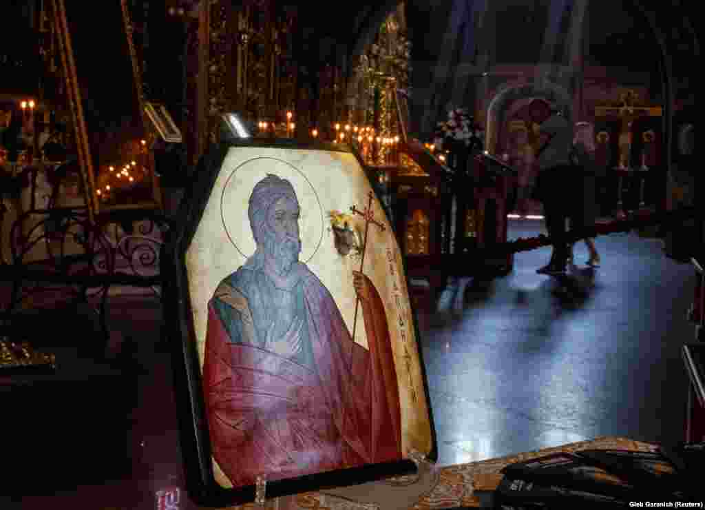 An orthodox icon is drawn on an armored plate with a bullet hole taken from the flak jacket of a Ukrainian soldier who survived, at St. Michael&#39;s Cathedral in Kyiv.