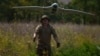 A Ukrainian soldier of the Ochi Reconnaissance Unit launches a Furia drone to fly over Russian positions at the front line in the Donetsk region, Ukraine, on June 30.