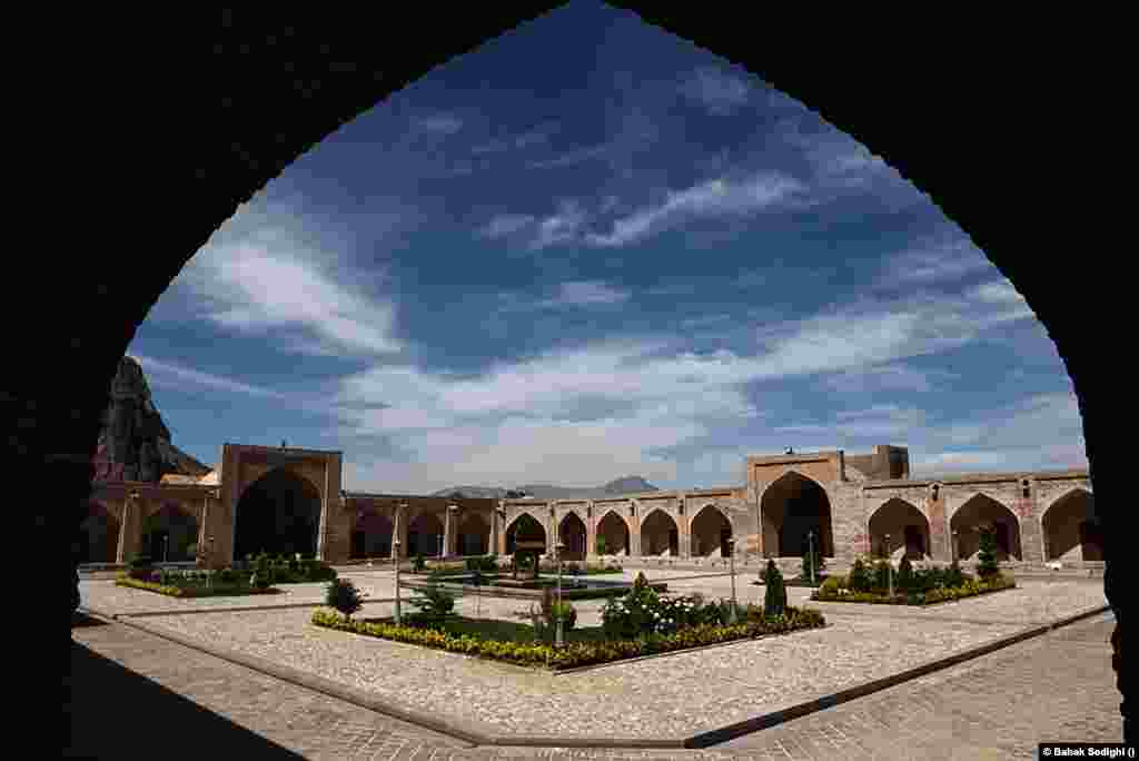 The Bisotun caravanserai, also known as the Sheikh Ali Khan caravanserai, is located in Bisotun, in Kermanshah Province. The style of this inn is of the Safavid period and is believed to have been built in the 12th century. It is considered one of the most beautiful monuments in western Iran. It features a central courtyard for animals and goods, along with chambers for travelers to rest. These structures were often fortified for protection. ​​​