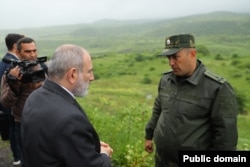 Armenian Prime Minister Nikol Pashinian (left) visits the newly delimited border with Azerbaijan in May.