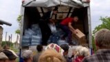 GRAB Ukrainians Brave Russian Attacks To Get Supplies To Flood-Stricken Villages