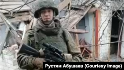 Rustyam Abushaev posted a video of himself in combat gear amid the ruins of a residential area that had been leveled by fighting.