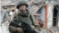 Rustyam Abushaev posted a video of himself in combat gear amid the ruins of a residential area that had been leveled by fighting.
