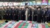 Supreme Leader Ayatollah Ali Khamenei (center) and other clerics pray over the coffins of President Ebrahim Raisi and other officials in Tehran on May 22. 