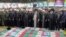 Supreme Leader Ayatollah Ali Khamenei (center) and other clerics pray over the coffins of President Ebrahim Raisi and other officials in Tehran on May 22. 