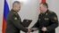 Russian Defense Minister Sergei Shoigu (left) and Belarusian Defense Minister Viktor Khrenin in Minsk on May 25.