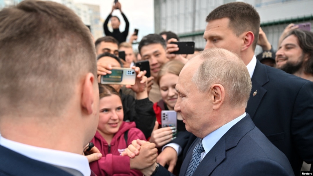 Russian President Vladimir Putin greets people in Yakutsk on June 18.
