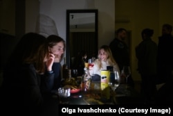 A party in a penthouse apartment of a high-rise building in Kharkiv during a blackout. Due to the lack of electricity, the elevator wasn’t working and guests had to walk up 24 flights of stairs to reach the gathering.