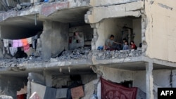 خانه در شهر غزه که بر اثر بمباران نیروهای اسرائیلی ویران شده است.