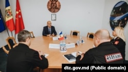 Константин Зябликов (в средата) присъства на среща с ръководството на Главното управление на карабинерите в Кишинев през август 2021 г.